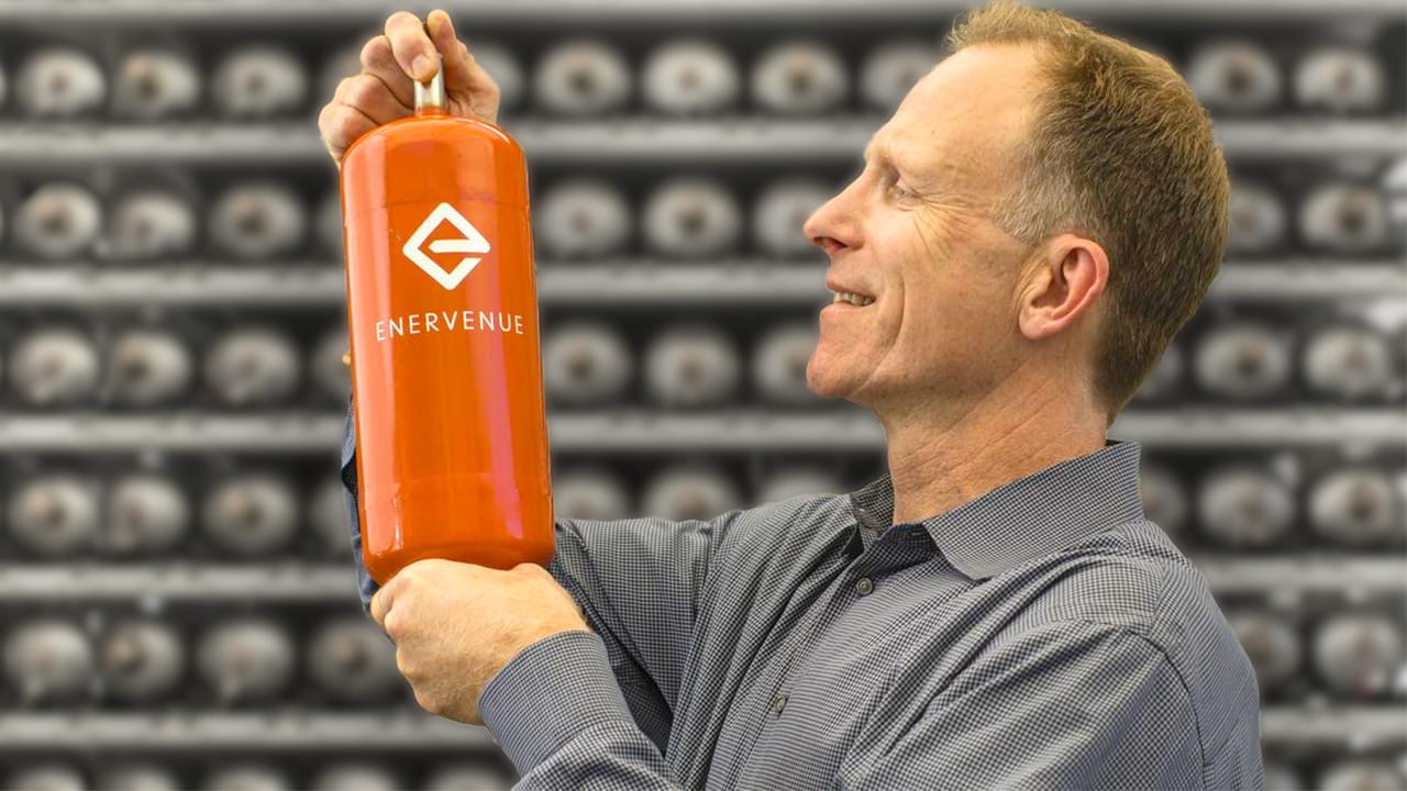A man looking at a Enervenue battery