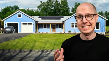 Matt Ferrell stood In front of his net zero home looking worried